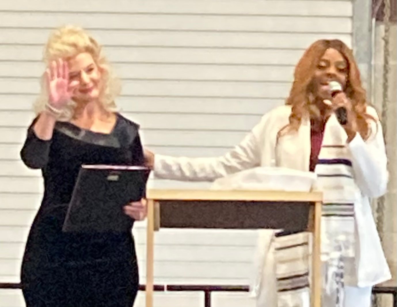 Pastor Neva Ford Nation presents award to Gonzales Mayor Connie Kacir.